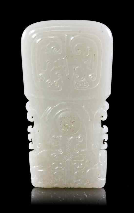 Appraisal: A White Jade Plaque in the form of a ritualistic