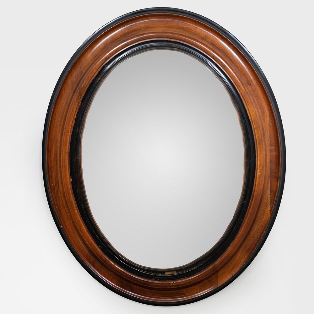 Appraisal: Edwardian Mahogany and Ebonized Oval Convex Mirror x in Condition