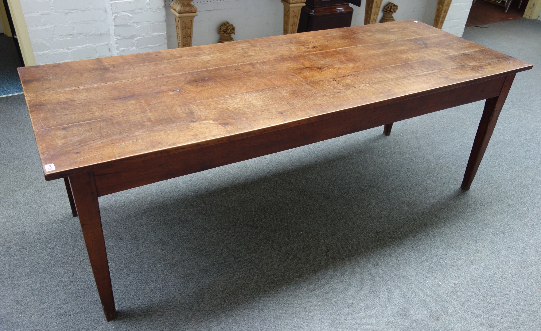 Appraisal: A th century French fruitwood kitchen table the triple plank