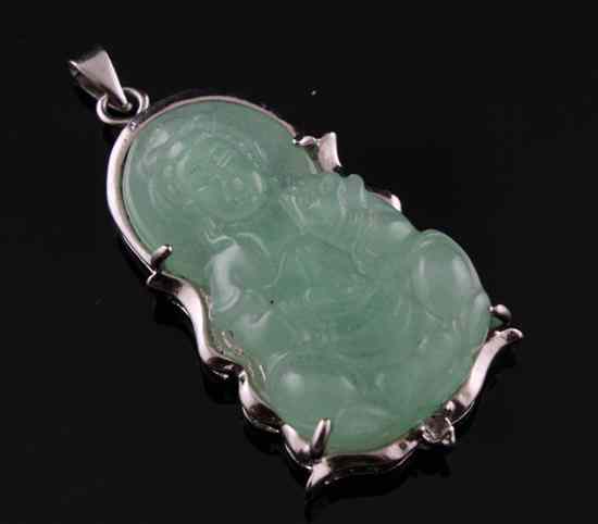 Appraisal: An ct white gold mounted jadeite pendant carved with figure