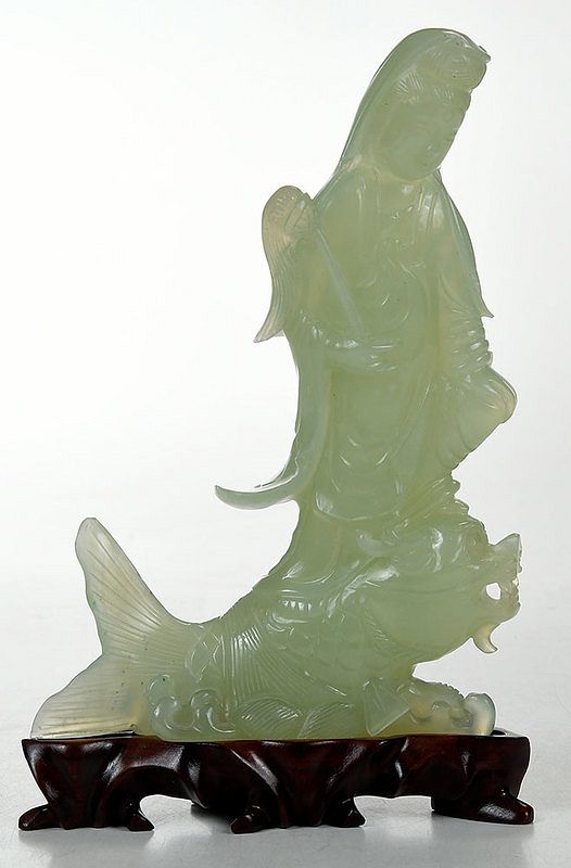 Appraisal: Carved Hardstone Guanyin Riding a Carp Chinese standing Guanyin holding