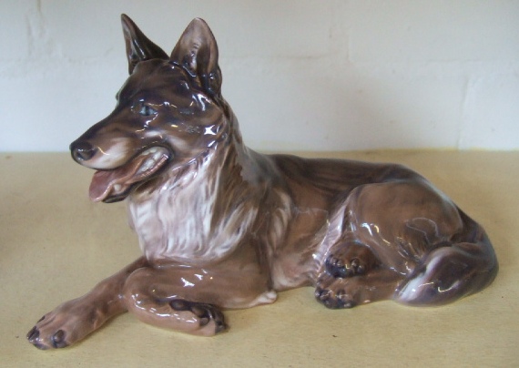 Appraisal: A Royal Copenhagen figure of a recumbent German shepherd No