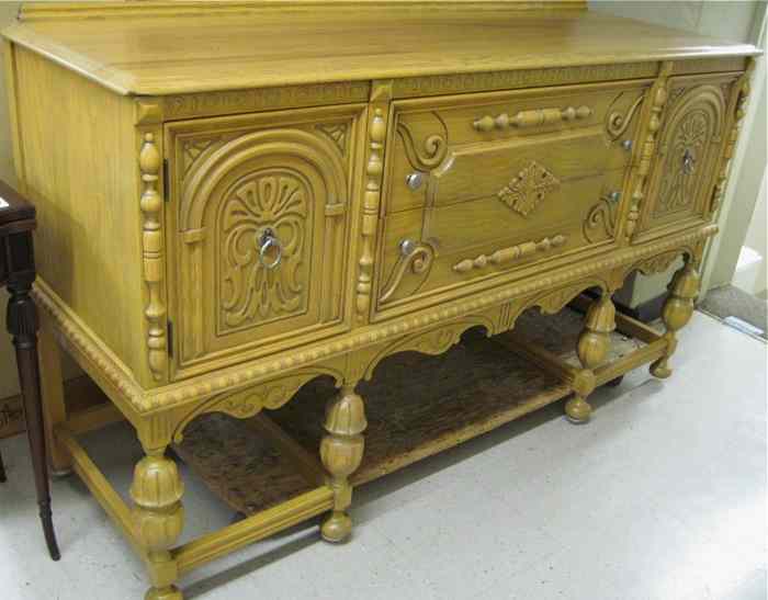 Appraisal: CARVED OAK SIDEBOARD American c 's having two drawers between