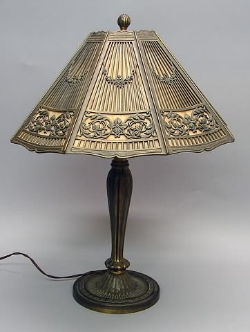 Appraisal: Sloping shade with slag glass panels bronze mounts with floral