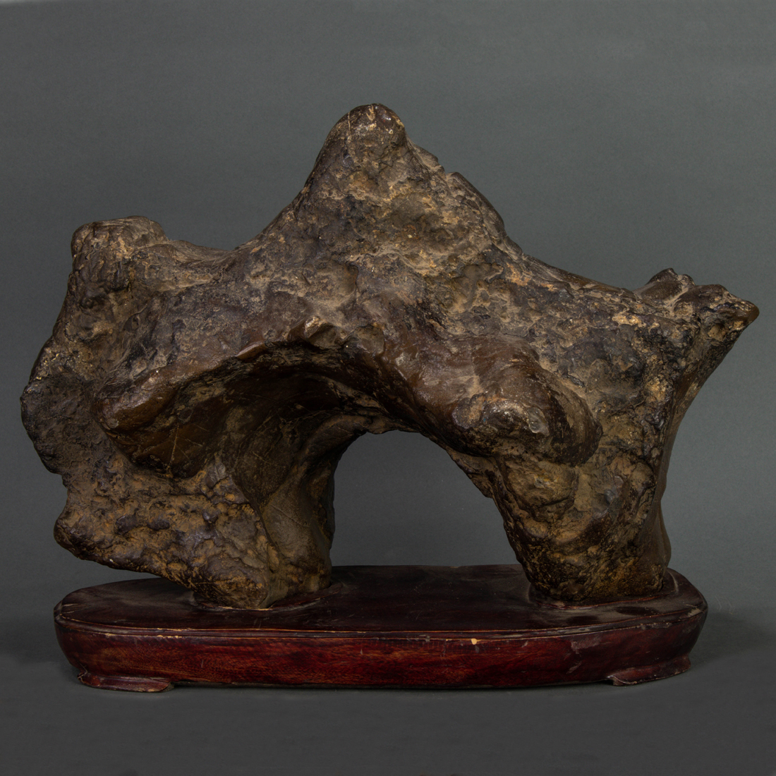 Appraisal: Chinese black Lingbi limestone scholar's rock of arching form displaying