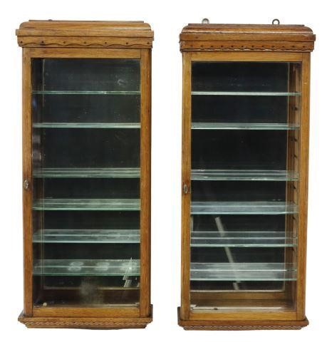 Appraisal: pair Hanging display cabinets early th c having carved and