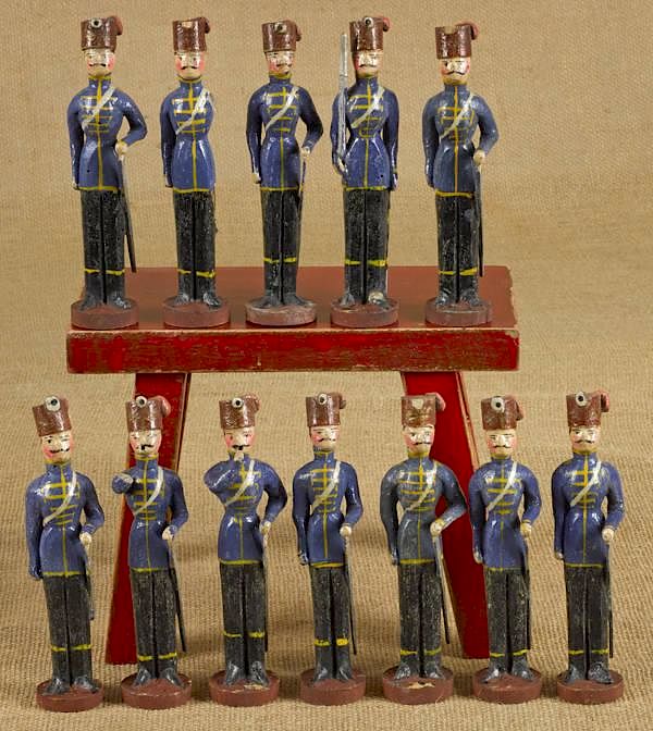 Appraisal: Set of twelve carved and painted wooden soldiers Set of