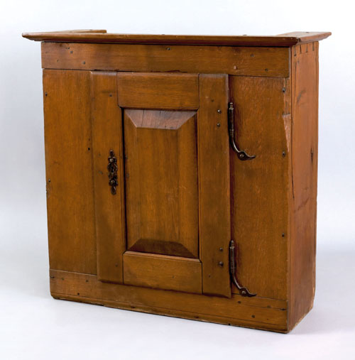 Appraisal: Pennsylvania walnut hanging cupboard late th c the molded cornice