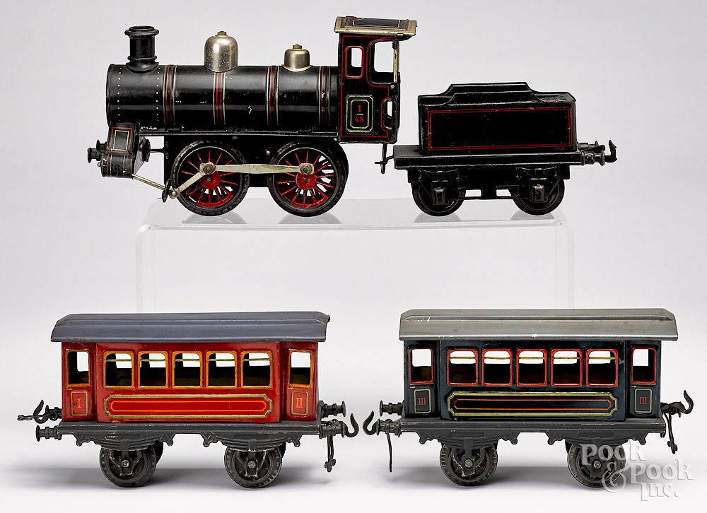 Appraisal: Bing painted tin clockwork four-piece train set Bing painted tin