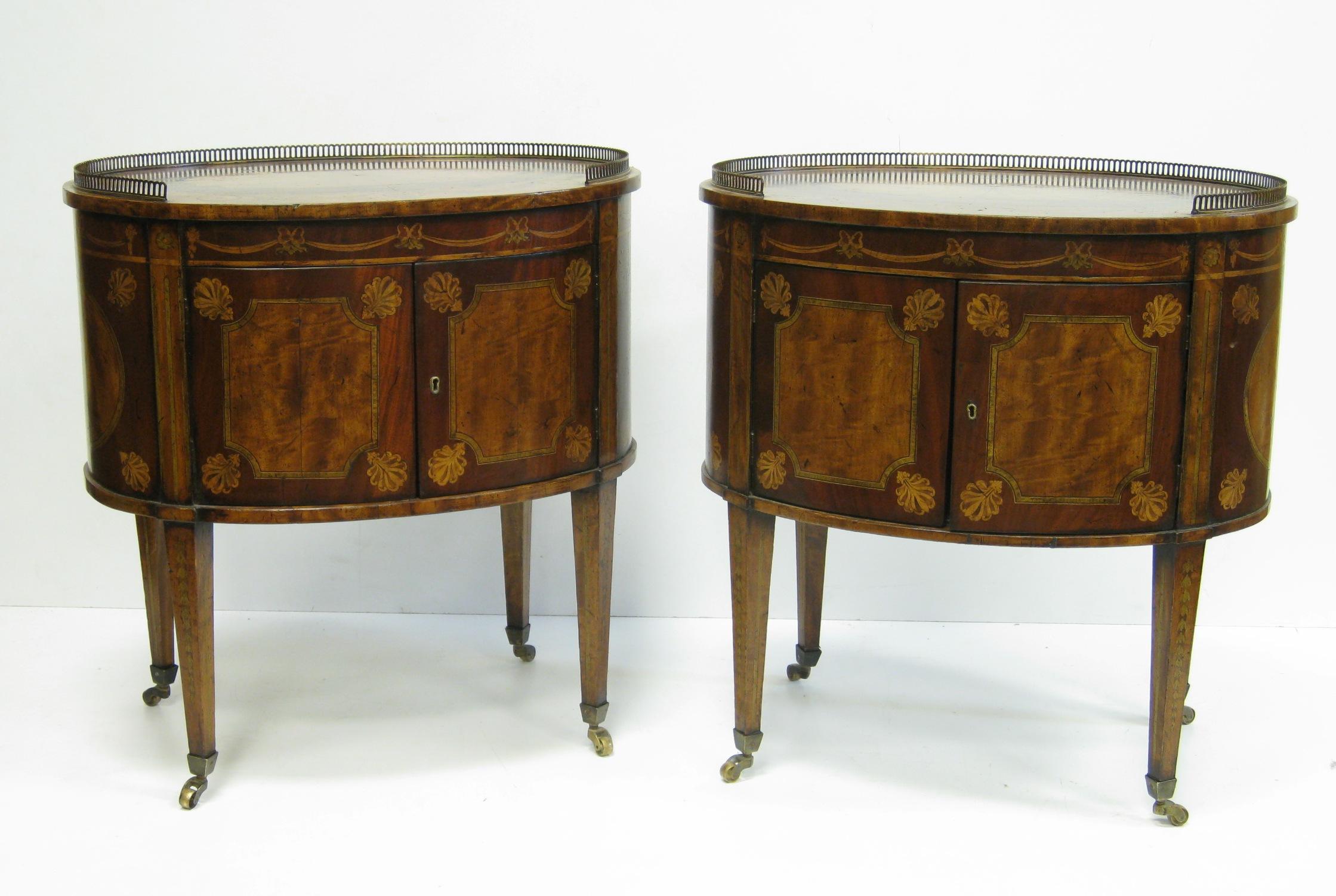 Appraisal: Pair of Sheraton style mahogany and satinwood oval Cabinets with