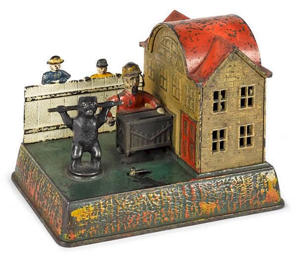 Appraisal: Cast iron organ grinder and dancing bear mechanic Cast iron