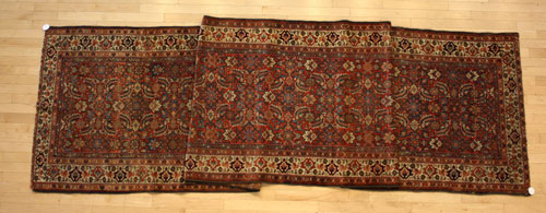 Appraisal: Hamadan runner ca with a brick red field and overall