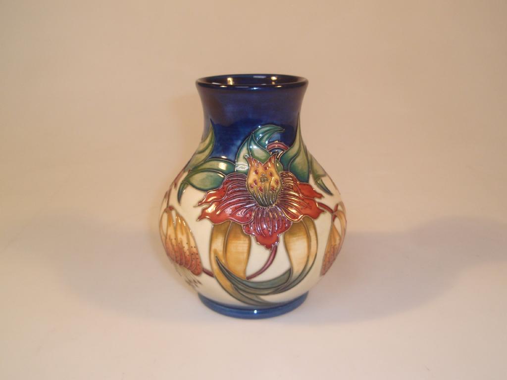 Appraisal: Moorcroft Modern a squat baluster vase decorated with Anna Lilies