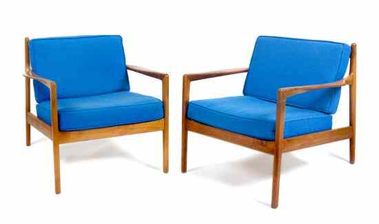 Appraisal: A Pair of Danish Open Arm Lounge Chairs Dux each