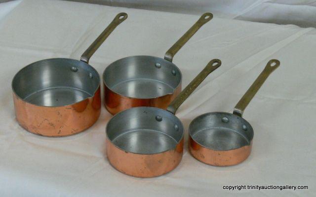 Appraisal: Copper Plated Stainless Measuring Cup Set with Brass handles cup