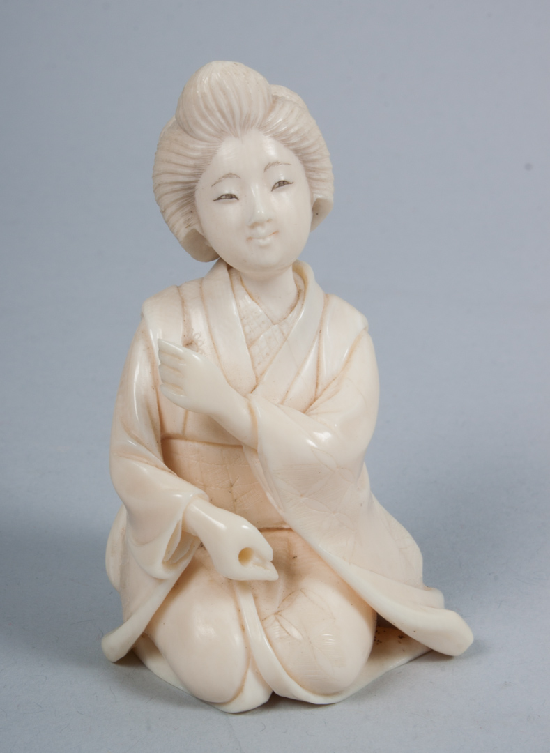 Appraisal: Japanese carved ivory geisha in H