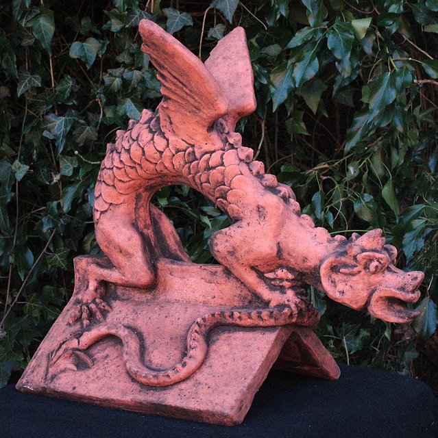 Appraisal: A CAST TERRACOTTA DRAGON ROOF RIDGE FINIAL of a dragon