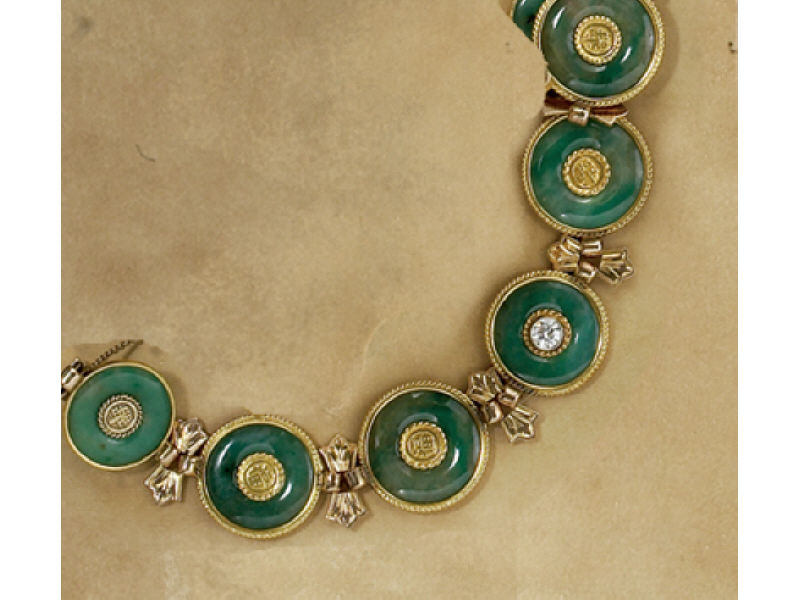 Appraisal: JADE BRACELET Yellow gold with seven green jade life savers