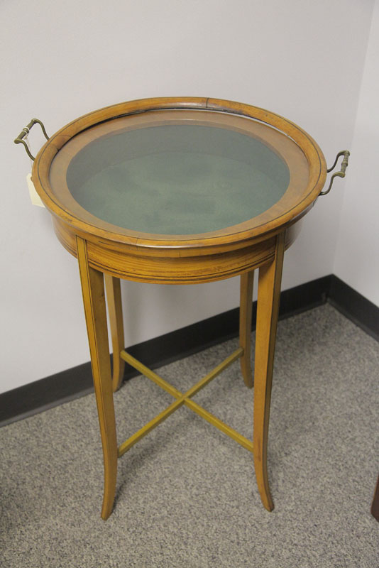 Appraisal: VITRINE Round mahogany vitrine having a glazed lift lid top