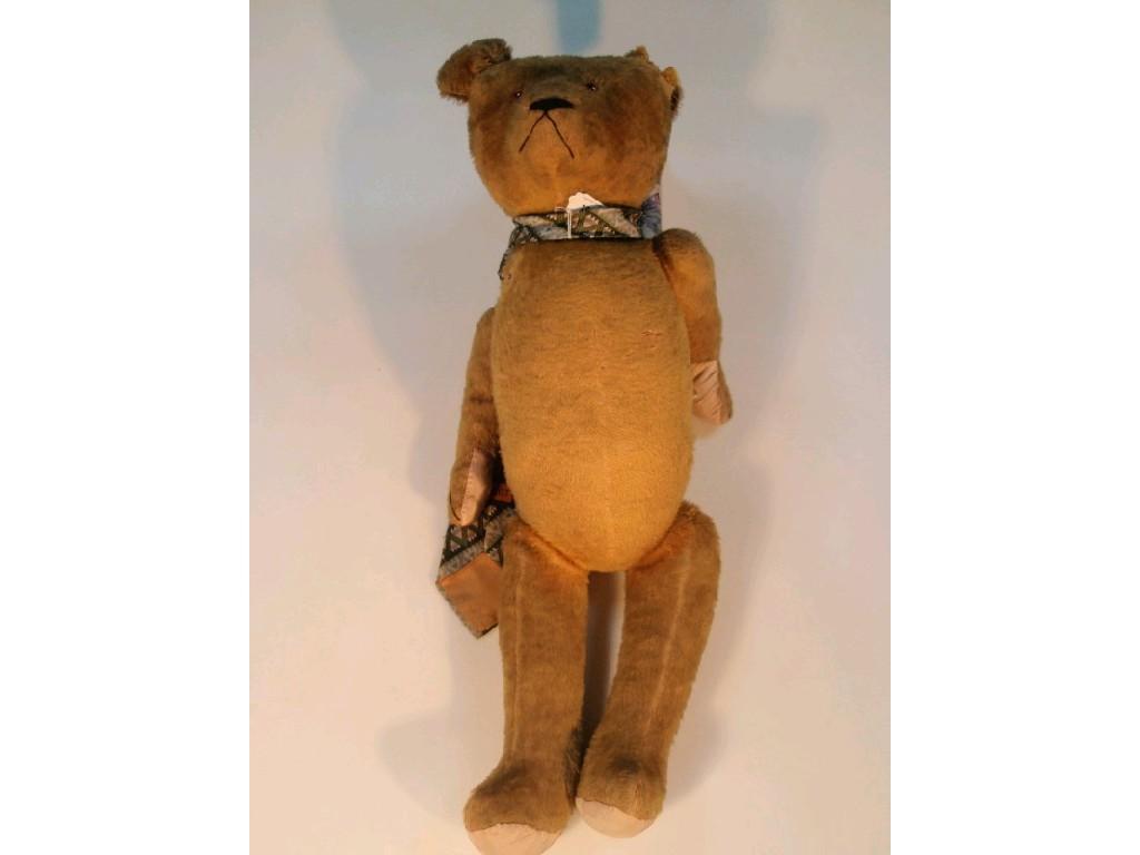 Appraisal: A large early thC teddy bear the yellow plush wood