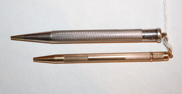 Appraisal: A SILVER LADIES 'YARD O LETTE' PROPELLING PENCIL with engine