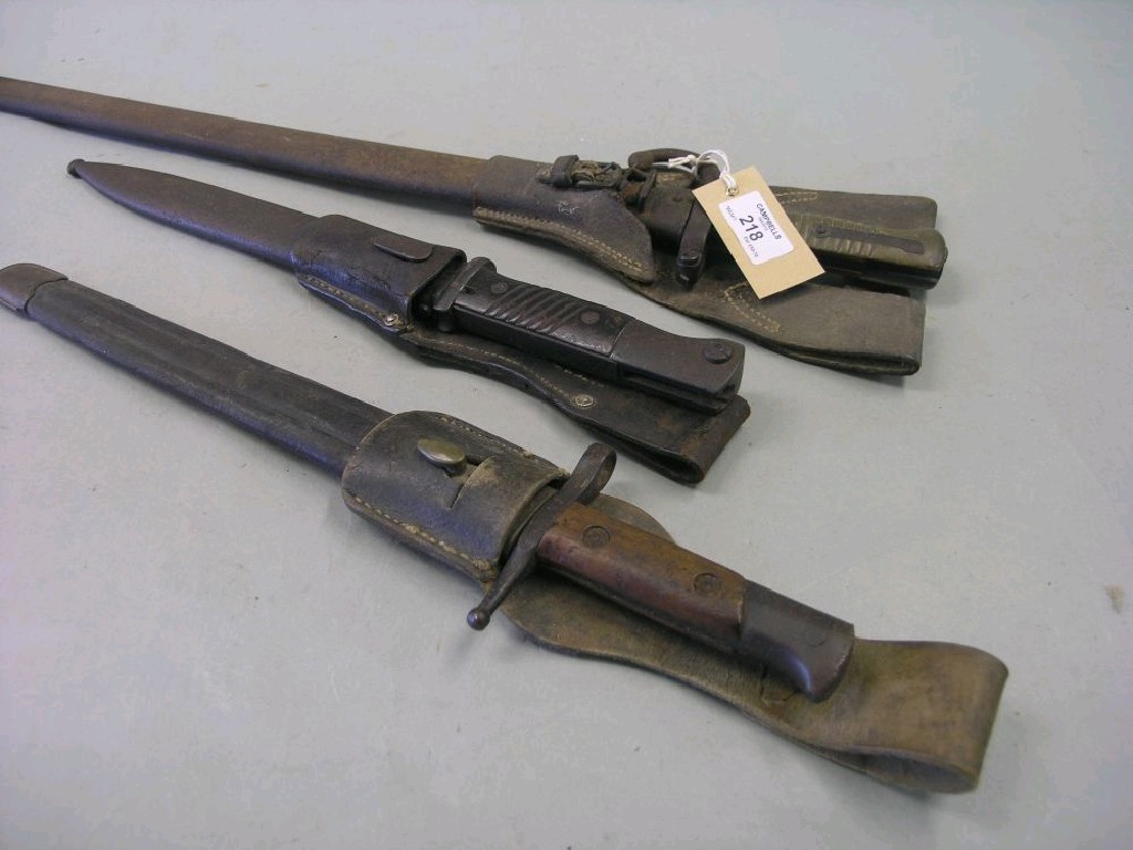 Appraisal: Three bayonets English French and German each within sheath