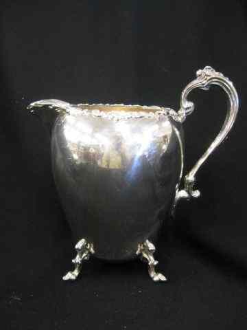 Appraisal: Silverplate Water Pitcher footed fancy trim '' excellent