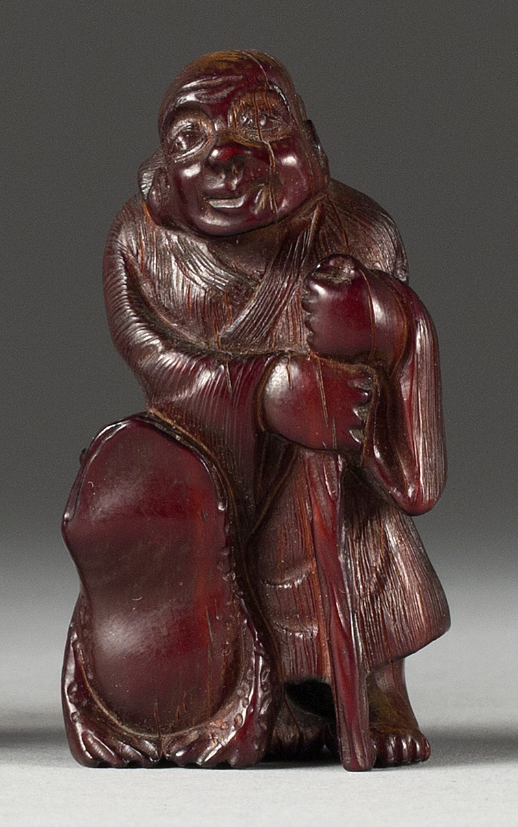 Appraisal: WOOD NETSUKE Late th CenturyIn the form of Gama Sennin