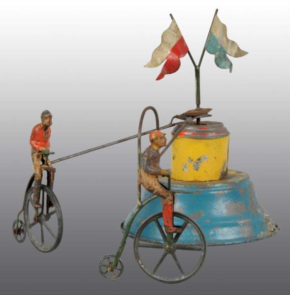 Appraisal: Tin Hand-Painted Bicycle Wind-Up Toy Description German When wound both