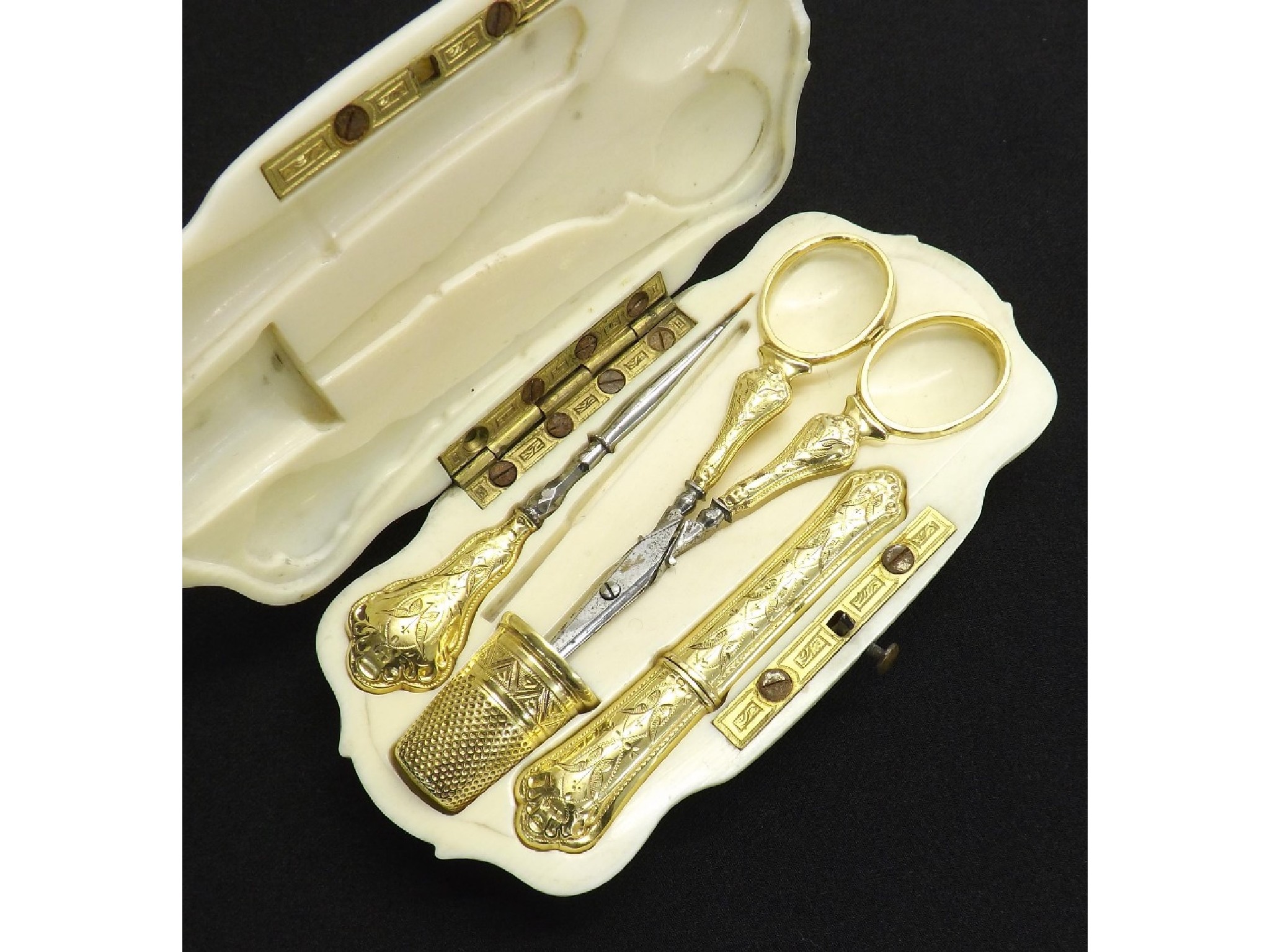 Appraisal: th century French ivory cased etui with gold implements the