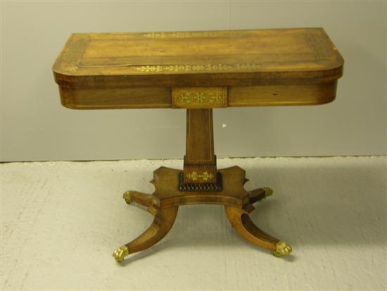 Appraisal: Regency rosewood folding card table with brass line and stylised