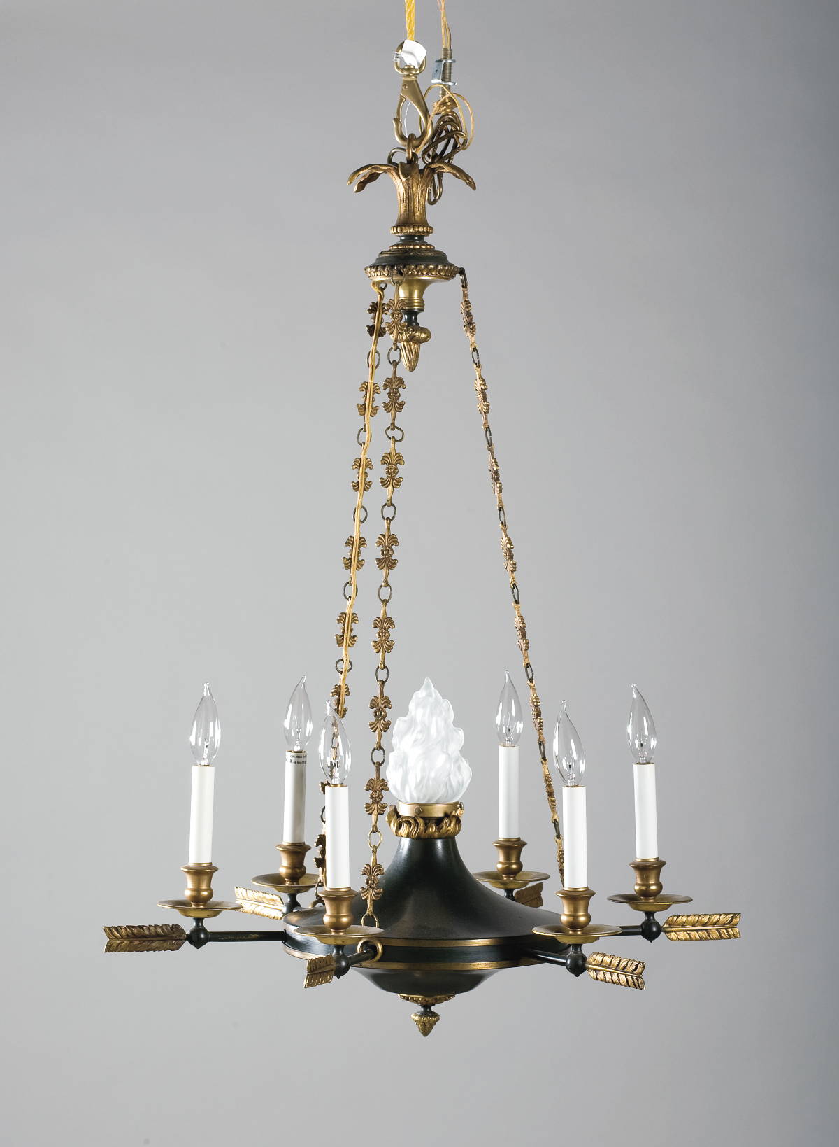 Appraisal: EMPIRE STYLE PATINATED AND GILT-METAL SIX-LIGHT CHANDELIER The leaftip corona