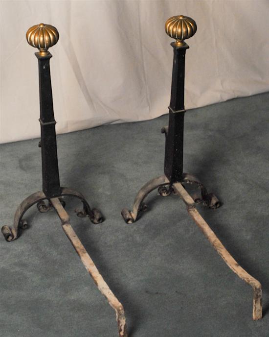 Appraisal: A Pair of Wrought-Iron Andirons with Brass Tops tapered square