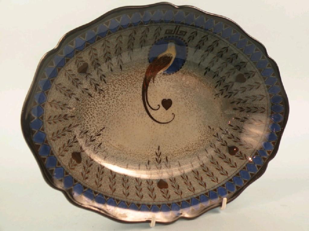 Appraisal: A Royal Doulton Titanian dish decorated with a Asiatic pheasant