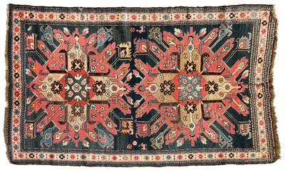 Appraisal: Kazak rug two large central medallions on blue field ivory