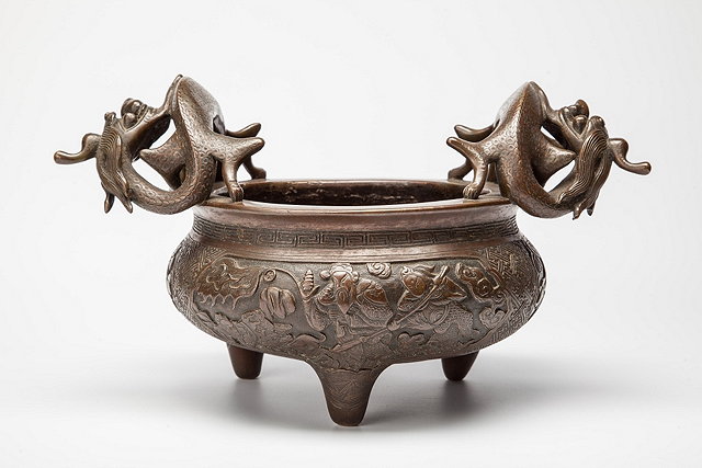 Appraisal: A CHINESE BRONZE CENSER with large dragon handles panels of