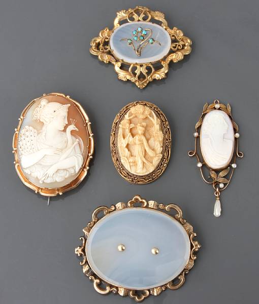 Appraisal: A collection of costume jewelry featuring five brooches three pendants