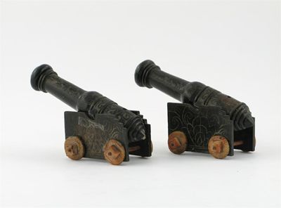 Appraisal: A pair of soapstone models of cannon carved in shallow