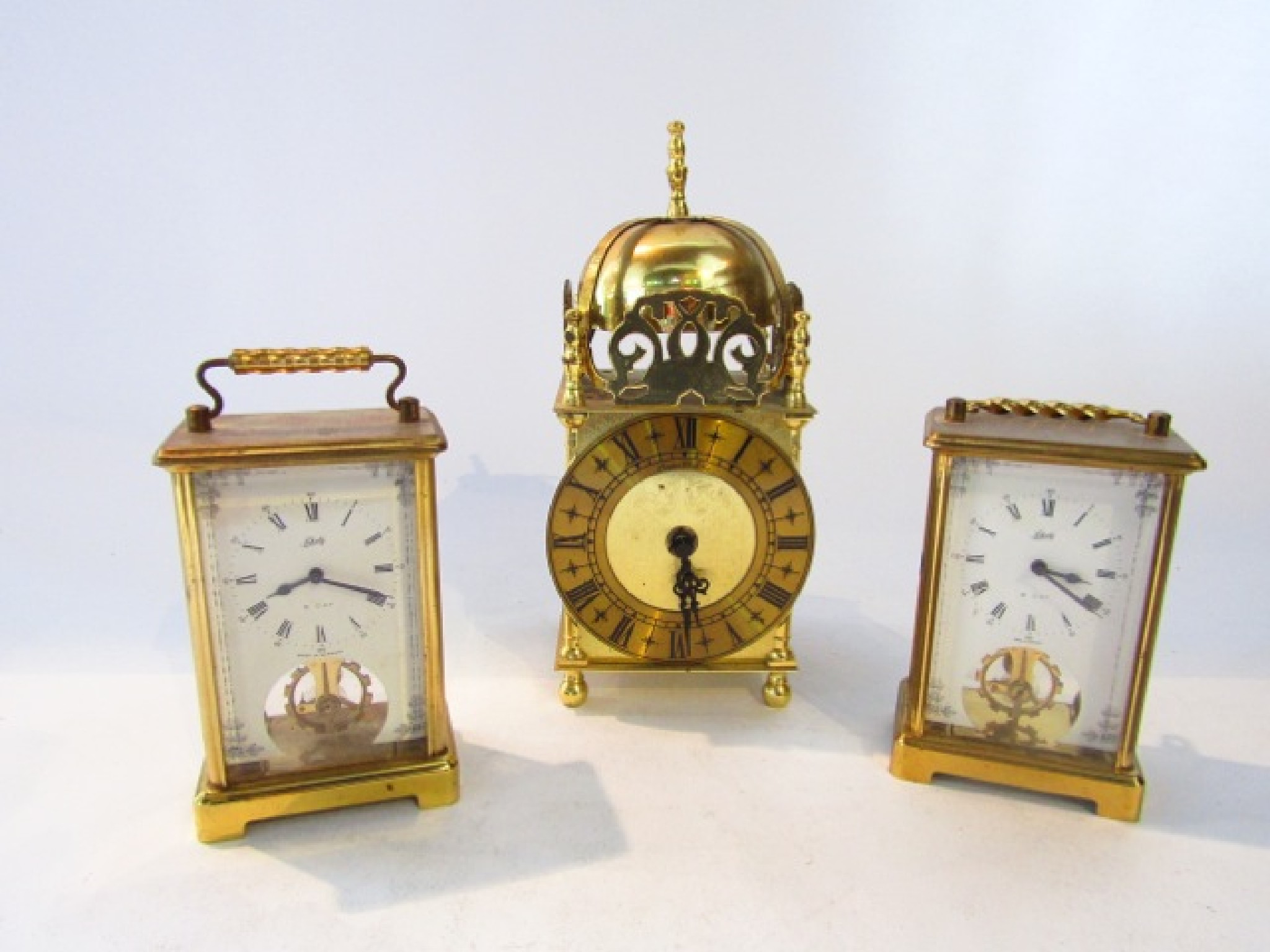 Appraisal: A reproduction lantern clock in an Old English style with