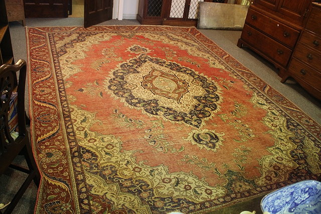 Appraisal: A RED GROUND CARPET possibly Afghan with allover foliate decoration