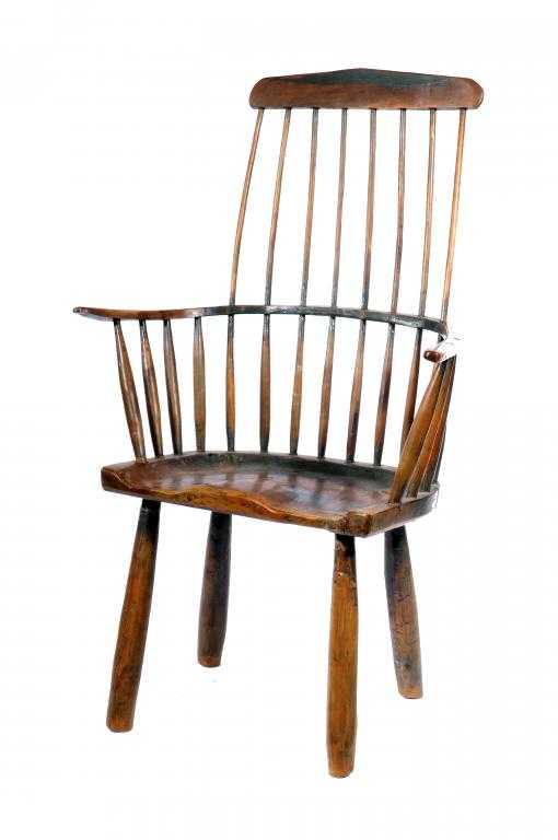 Appraisal: A GEORGE III YEW-WOOD COMB BACK WINDSOR CHAIR with saddle