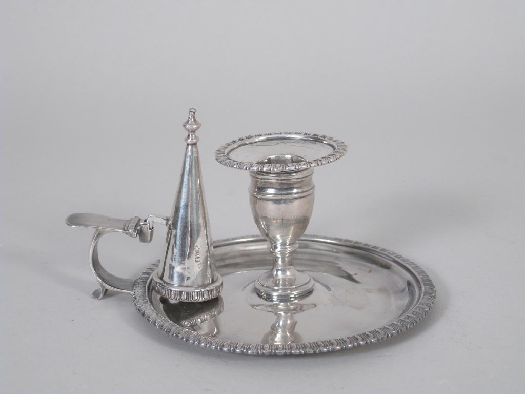 Appraisal: A George III circular Chamber Candlestick and Snuffer engraved crest