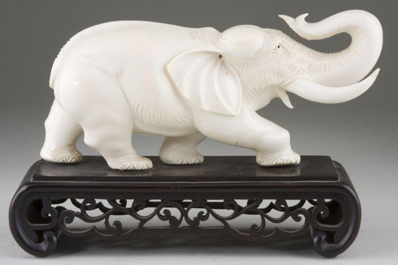 Appraisal: Carved Asian Ivory Elephant th century mounted to a custom