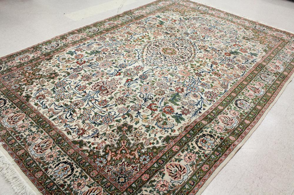 Appraisal: HAND KNOTTED ORIENTAL CARPET Indo-Persian floral and central floral medallion