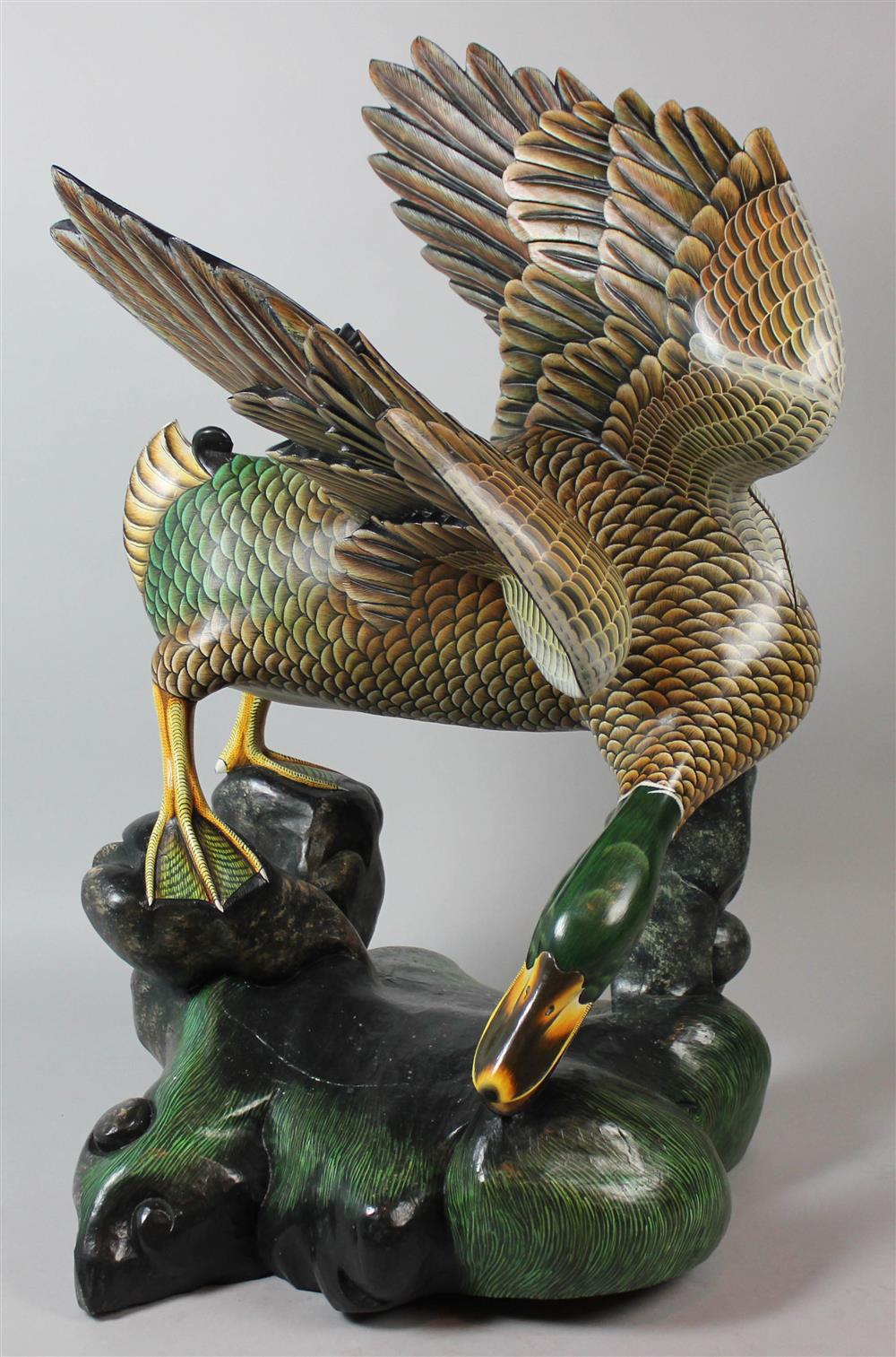 Appraisal: INDONESIAN CARVED WOOD AND PAINTED MALLARD the large duck with