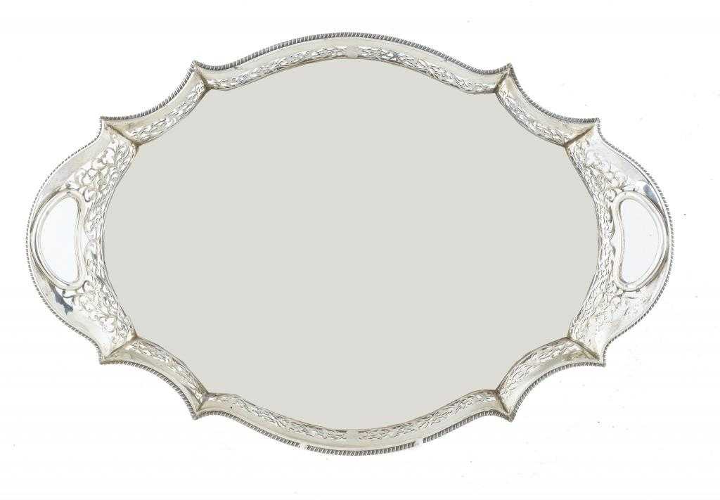 Appraisal: A GEORGE V TEA TRAY shaped oval with saw pierced