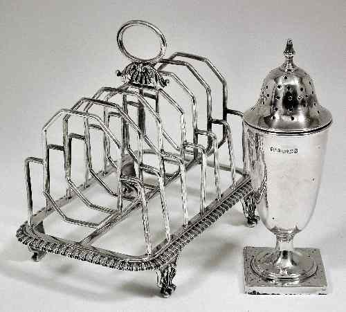 Appraisal: A George III silver six division toast rack with gadrooned