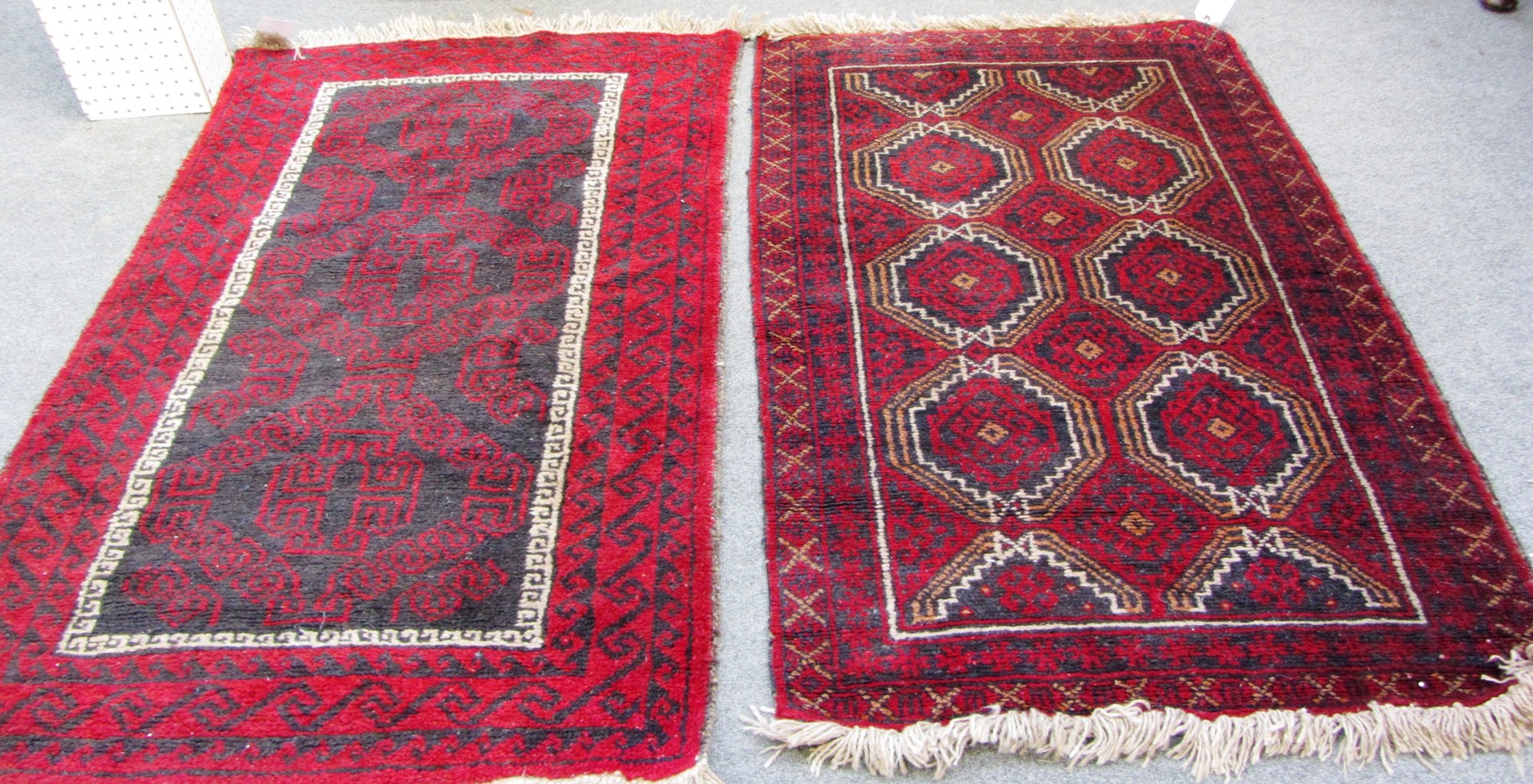 Appraisal: An Afghan Beluche rug the black field with three fret