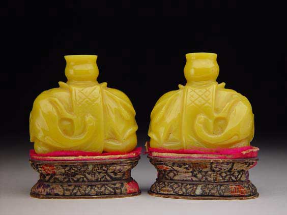 Appraisal: PAIR YELLOW GLASS SNUFF BOTTLES Pair of antique carved Imperial