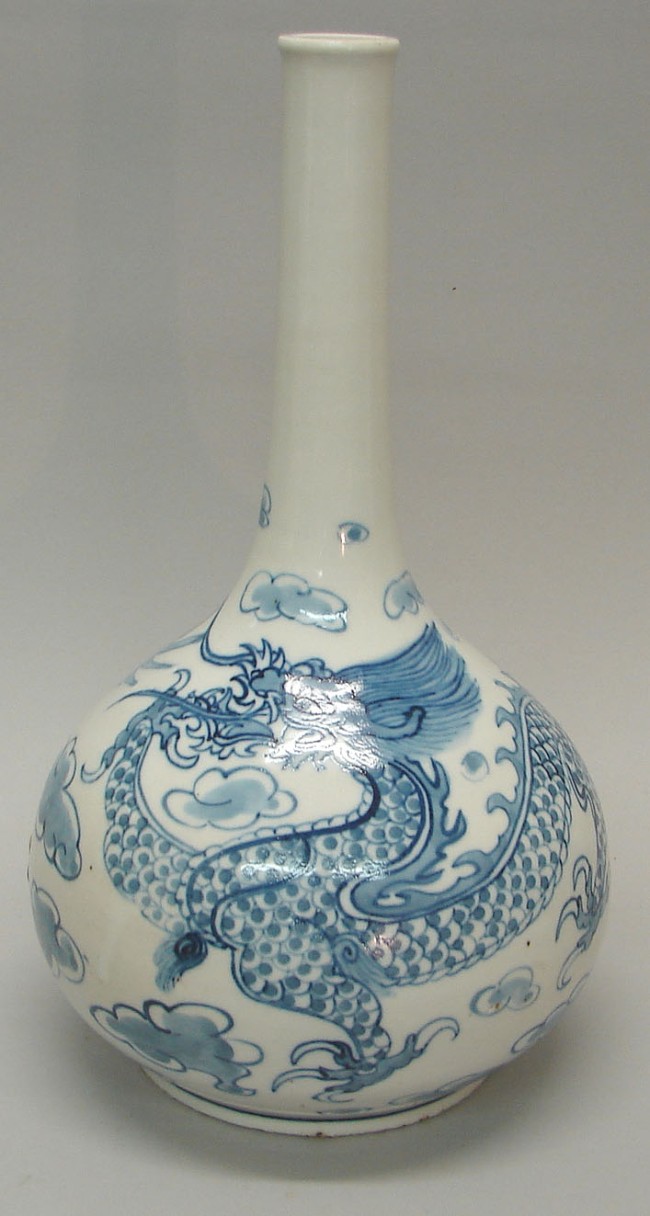 Appraisal: Blue and white vase featuring dragon and cloud motif t